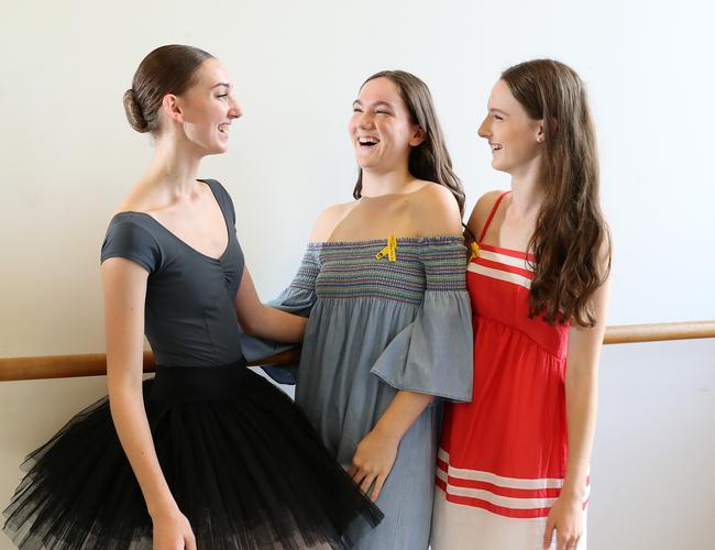 Allison Baden-Clay's two eldest daughters Sarah and Hannah, right, with the 2018 Allison Baden-Clay Scholarship recipient Taji Hennessy, left. Picture: Liam Kidston