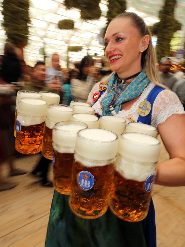 A waitress carries 1-liter-mugs of beer during the opening weekend of the last Oktoberfest in 2019 before the festival was cancelled for two years during Covid lockdowns. Picture: Getty Images.