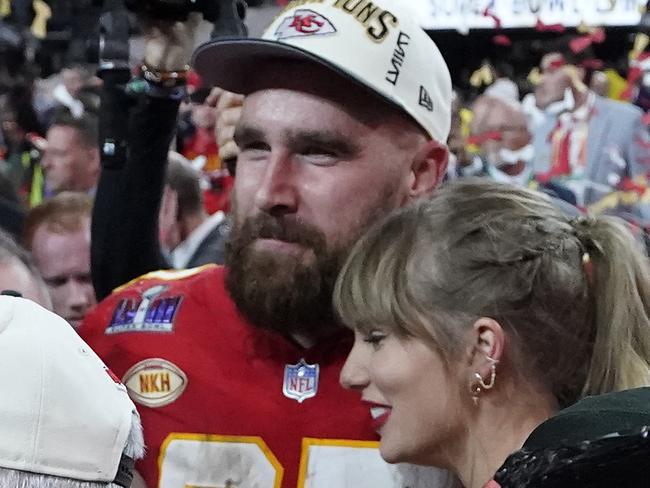 Kelce Swift embrace as they celebrate his team winning the Super Bowl. (Photo by TIMOTHY A. CLARY / AFP)