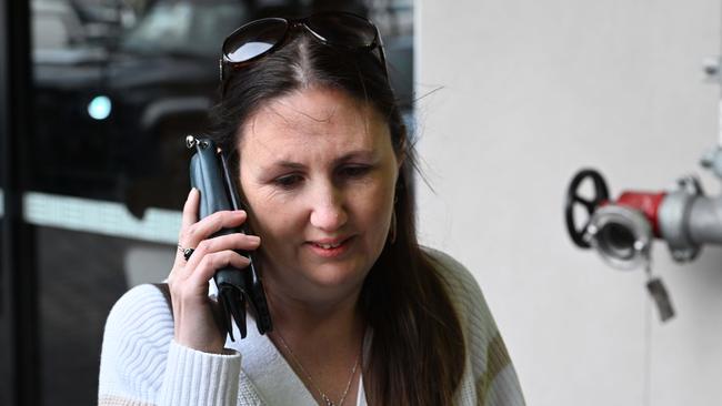 Tania Reckwell talks to her son Zac who is locked in the Westfield Marion where armed youths were reported inside. Picture: NewsWire / Brenton Edwards