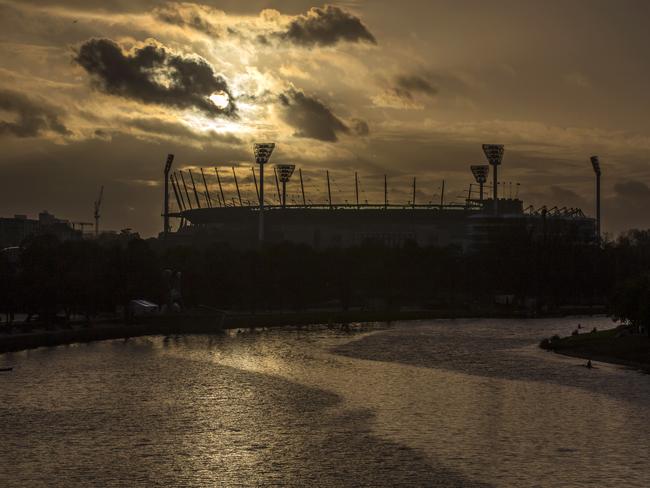 The sun rises over the MCG ahead of the Grand Final. Picture: Sarah Matray