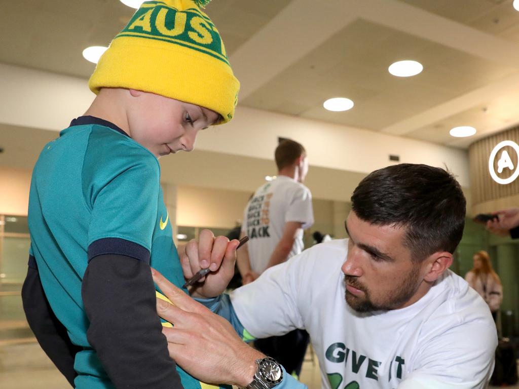Socceroos Captain Matthew Ryan signed an autograph for a young fan. Picture: Damian Shaw