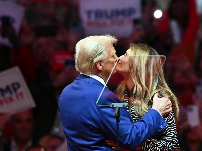 Donald Trump kisses former first lady Melania Trump at Madison Square Garden in New York. Picture: AFP