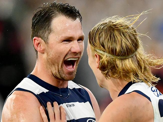 MELBOURNE, AUSTRALIA - JUNE 29: Oliver Dempsey of the Cats is congratulated by Patrick Dangerfield after kicking a goal during the round 16 AFL match between Geelong Cats and Essendon Bombers at Melbourne Cricket Ground, on June 29, 2024, in Melbourne, Australia. (Photo by Josh Chadwick/AFL Photos/via Getty Images)