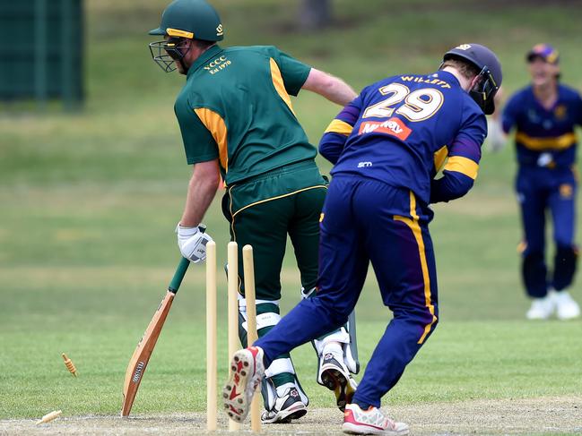 VTCA: Yarraville Club’s Ashley Sweet is stumped by Druids keeper Oliver Willett. Picture: Steve Tanner