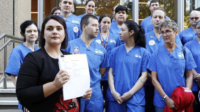 DAILY TELEGRAPH. MARCH 15, 2023.Pictured holding a press conference in Sydney today is The NSW Nurses and MidwivesÃ Association General Secretary, Shaye Candish, with members of NSWNMA, who will today confirm it is filing a major prosecution case in the Supreme Court against the state of NSW for systemic and repeated breaches of the Public Health System NursesÃ and MidwivesÃ State Award. Picture: Tim Hunter.