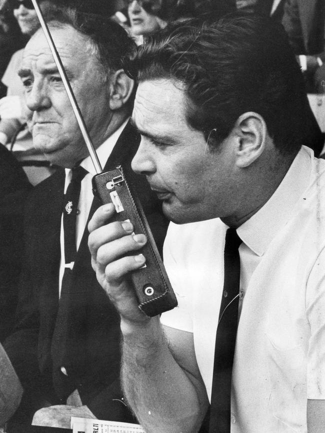 Coach Ron Barassi uses a walkie-talkie<br/>two way radio on the sidelines during <br/>Sturt vs Carlton Champions of Australia <br/>match at Adelaide Oval, 05 Oct. 1968.