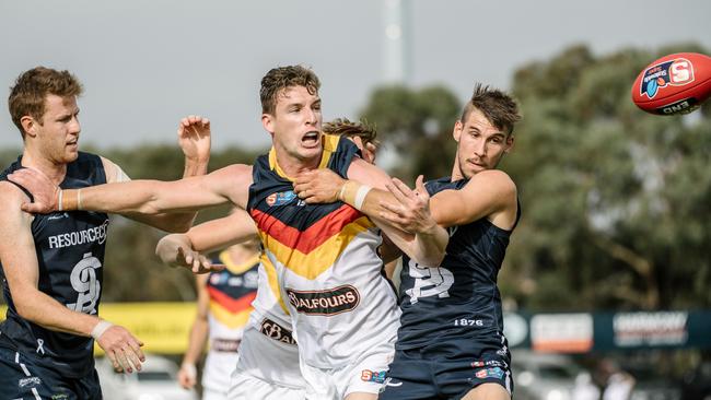 Adelaide forward Josh Jenkins battles with South Adelaide players Benjamin Haren and Tyson Brown in the SANFL match at Noarlunga Oval on Saturday. Picture: AAP Image/ Morgan Sette