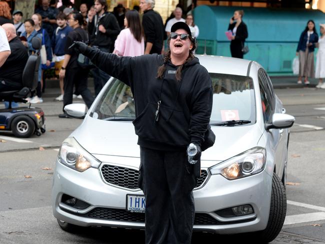 One protester intentionally blocked a female driver on Swanston St. Picture: Andrew Henshaw