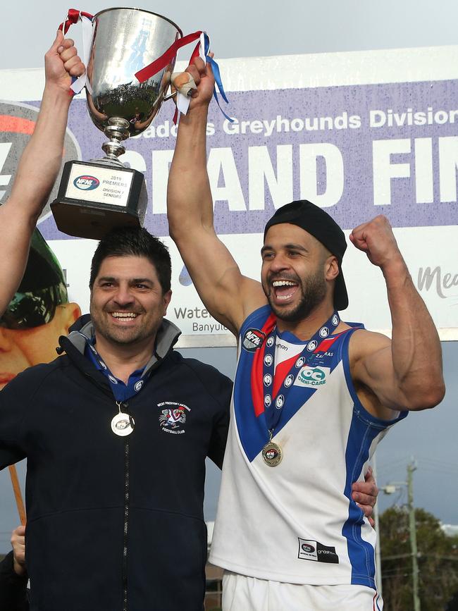 Ahmed Saad lifts the Division 1 premiership trophy in 2019. Picture: Hamish Blair