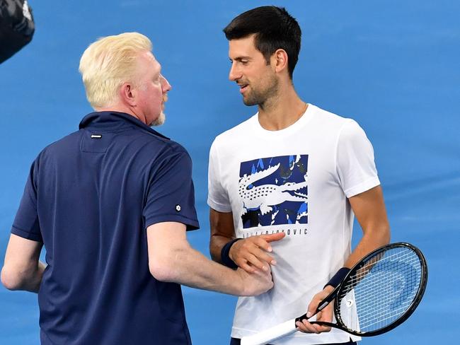 German ATP Cup captain Boris Becker (left) chats with Novak Djokovic in Brisbane on Thursday. Picture: AAP