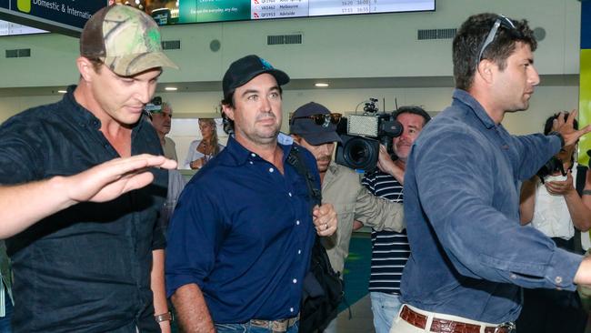 The group powered through the waiting media pack before one of the members of his team was seen pushing a cameraman out of the way. Picture: Glenn Campbell