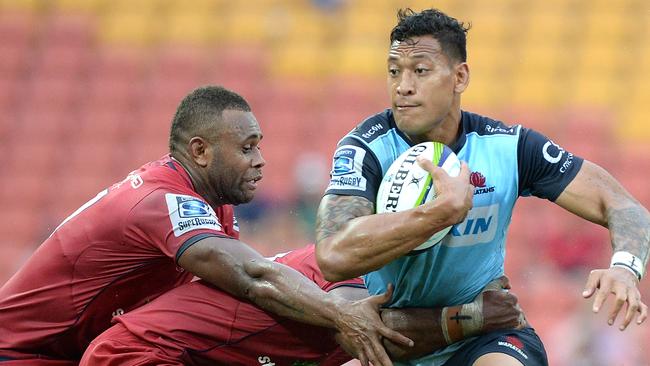 BRISBANE, AUSTRALIA - MARCH 27: Israel Folau of the Waratahs takes on the defence during the round five Super Rugby match between the Reds and the Waratahs at Suncorp Stadium on March 27, 2016 in Brisbane, Australia. (Photo by Bradley Kanaris/Getty Images)