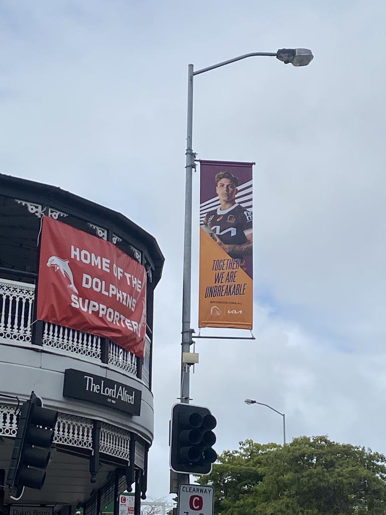 The Dolphins' sign next to Broncos advertising at the Lord Alfred Hotel on Caxton Street in Brisbane.