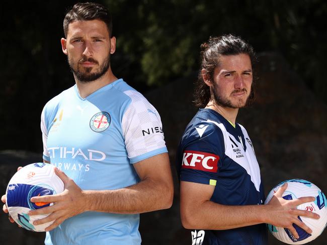 MELBOURNE, AUSTRALIA - DECEMBER 14: Mathew Leckie of Melbourne City and Marco Rojas of Melbourne Victory pose for a photo during an A-League media opportunity at Birrarung Marr on December 14, 2021 in Melbourne, Australia. (Photo by Mike Owen/Getty Images for APL)