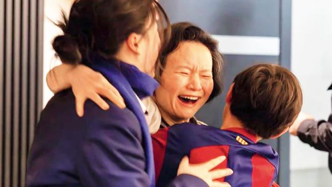 Cheng Lei reunited with her daughter Ava, left and son Alex, right at Melbourne airport on 11 October 2023, after three years in custody. Picture: DFAT