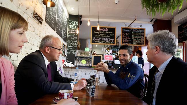 Liberals have taken aim at Labor, calling the Opposition “lazy”. Summer Hill Labor MP Jo Haylen, Opposition leader Luke Foley and Labor Upper House MP Adam Searle talk with Kelby's Cafe owner, Moe Issa in Marrickville. Picture: AAP