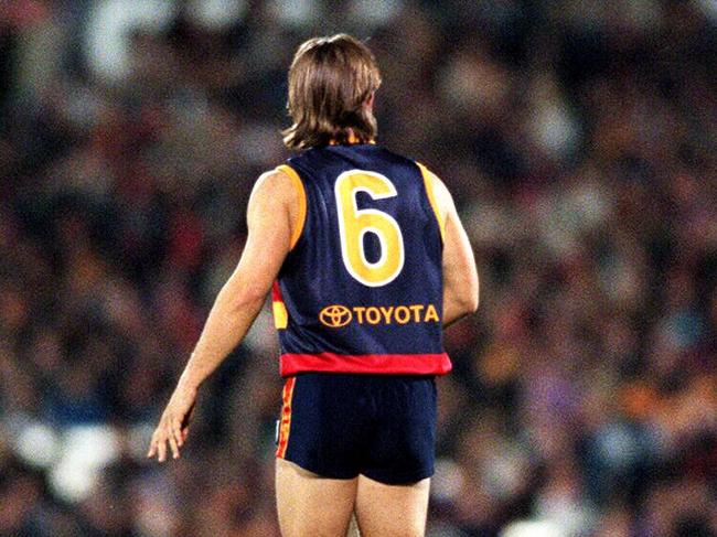 Footballer Tony Modra wearing Number 6 guernsey looking at crowd prior to comeback match after long absence due to injury.AFL football - Adelaide Crows vs Carlton match at Football Park. six