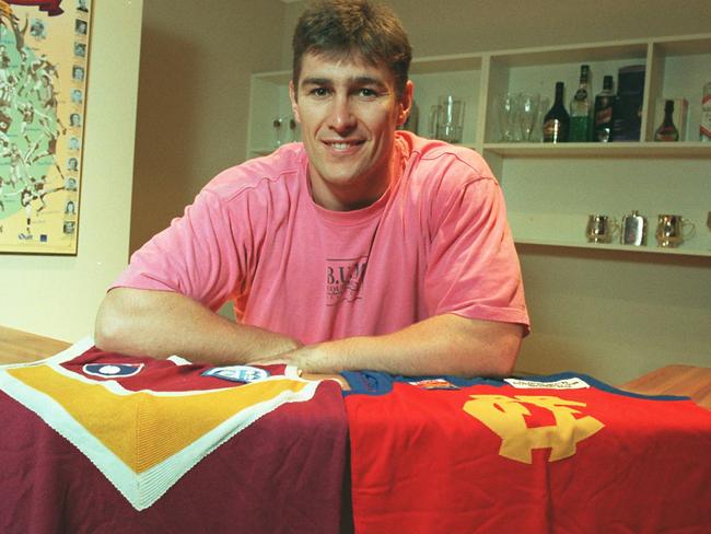 FITZROY LIONS AND BRISBANE BEARS MERGER - ALASTAIR LYNCH at home with jumpers. Jul 1996 Sport AFL Qld brisbane lions headshot alone