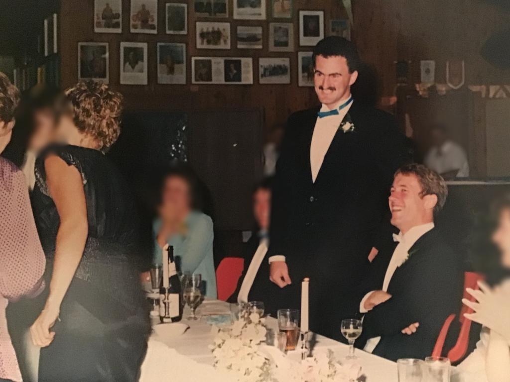 Jamie Flanagan standing at his childhood friend's (Ian Findlay sitting) wedding. Supplied