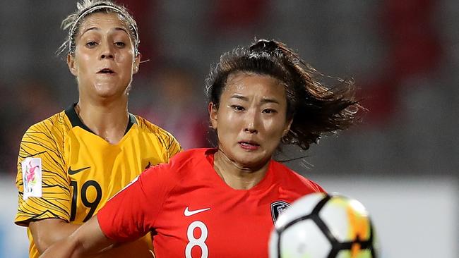 AMMAN, JORDAN - APRIL 07: Katrina Gorry of Australia and Cho So Hyun of Korea Republic in action during the AFC Women's Asian Cup Group B match between Australia and South Korea at the King Abdullah II Stadium on April 7, 2018 in Amman, Jordan.  (Photo by Francois Nel/Getty Images)