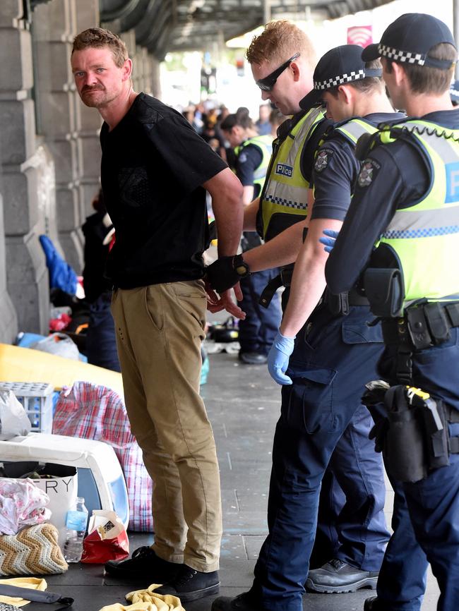 He is handcuffed. Picture: Nicole Garmston. Picture: Nicole Garmston