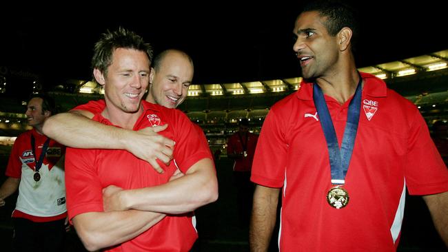 Stuart Maxfield gets a hug from Matthew Nicks as Michael O'Loughlin and Jude Bolton look on after Sydney’s 2005 grand final win.