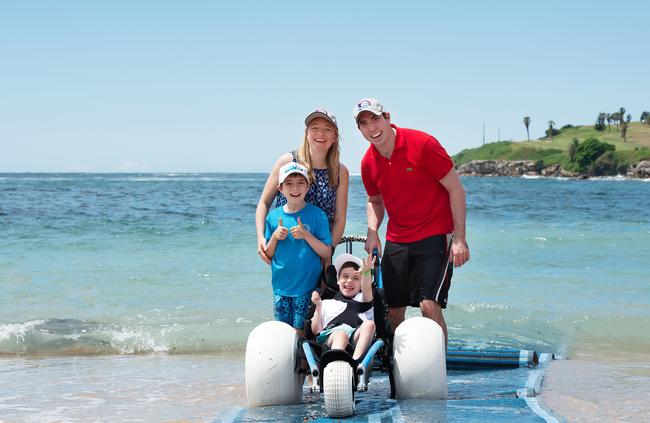 Sawyer and Hudson with parents Petra and Steve, enjoy the opportunity to splash in the water. Image: Monique Harmer