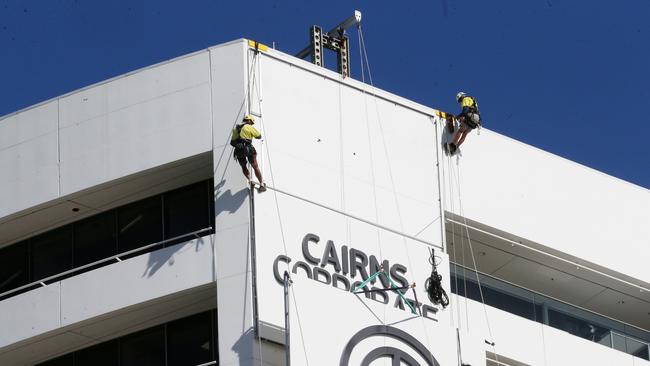 In 2019 workers from Cairns Rope Access and Expressway Signs &amp; Printworks installed huge signs on the side of the Cairns Corporate Tower. PICTURE: STEWART MCLEAN