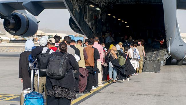 Evacuees boarding a C-17 Globemaster III at Kabul’s Hamid Karzai International Airport last week. Picture: AFP