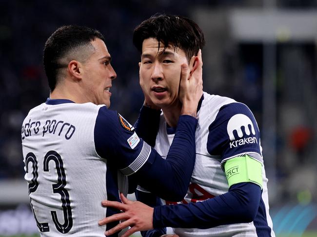 Son Heung-Min celebrates with teammate Pedro Porro after scoring his team's third goal during the UEFA Europa League. Picture: Alex Grimm/Getty Images