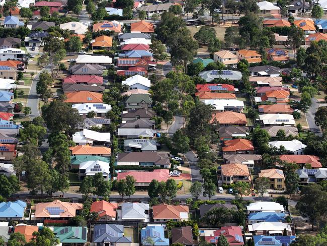 Aerial images of suburban house in South-West Brisbane. Generic houses, roof, solar panel, leafy suburb.