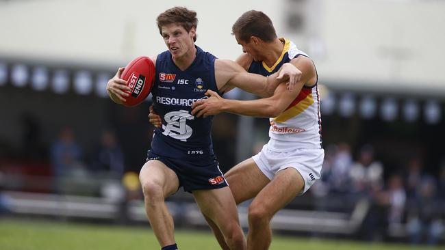 Crows young gun Jackson Edwards tackles South’s Matt Rose earlier this year. Picture Deb Curtis