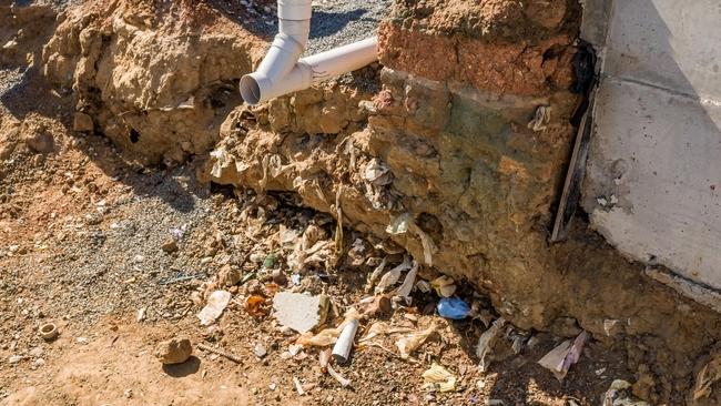 An amenities block at Bundaberg’s new aquatic centre was being built on a foundation of uncompacted landfill including garbage and glass bottles, requiring out of sequence remediation work adding to the cost of the project.