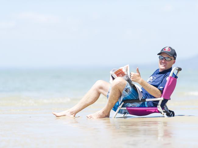 Rod Cleary catches up on the last of the news from 2014 at Blairgowrie beach. Picture: Eugene Hyland