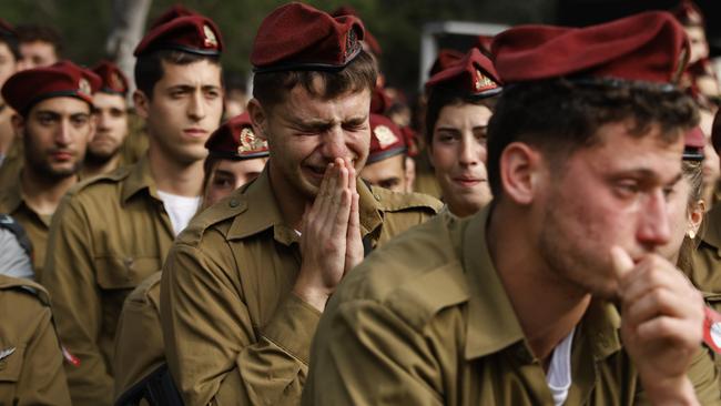 Israeli soldiers mourn at the funeral of IDF Sgt. David Sassoon in Netanya, who was killed in Gaza, raising the Israeli troop death toll to 247. Picture: Amir Levy/Getty Images