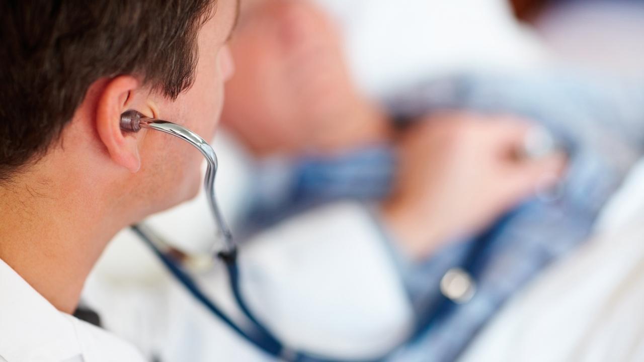 Generic image of a doctor examining a patient's heart beat with a stethoscope.