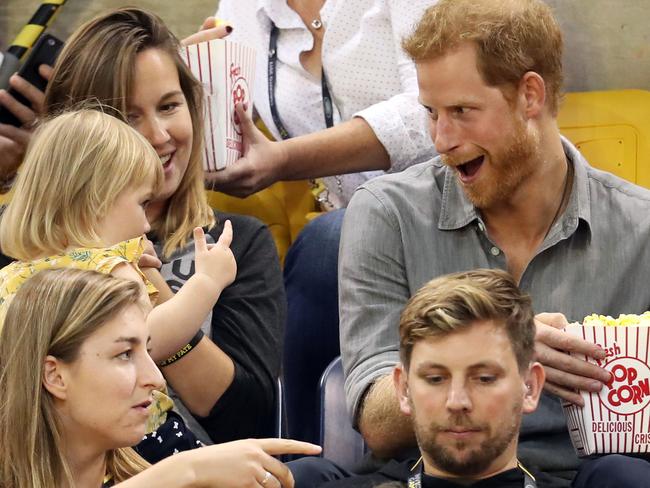 TORONTO, ON - SEPTEMBER 27:  Prince Harry (R) sits with David Henson's wife Hayley Henson (L) and daugther Emily Henson at the Sitting Volleyball Finals during the Invictus Games 2017 at Mattamy Athletic Centre on September 27, 2017 in Toronto, Canada.  (Photo by Chris Jackson/Getty Images for the Invictus Games Foundation)