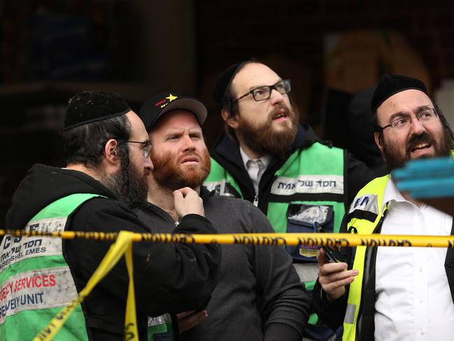 Emergency workers in the aftermath of the mass shooting at the JC Kosher Supermarket on December 11 in Jersey City. Picture: AFP