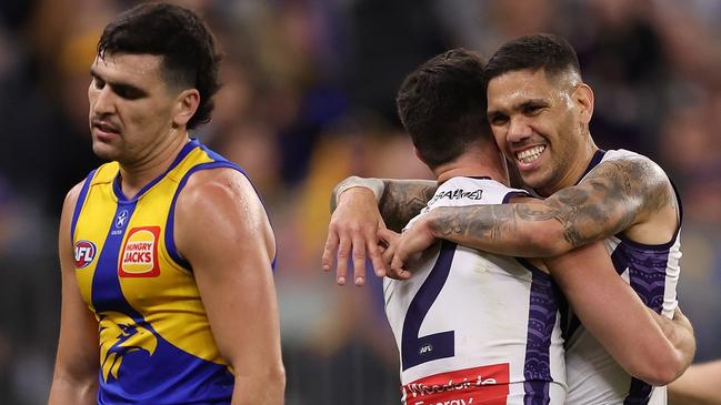 PERTH, AUSTRALIA - AUGUST 12: Jaeger O'Meara and Michael Walters of the Dockers celebrate a goal during the round 22 AFL match between West Coast Eagles and Fremantle Dockers at Optus Stadium, on August 12, 2023, in Perth, Australia. (Photo by Paul Kane/Getty Images)