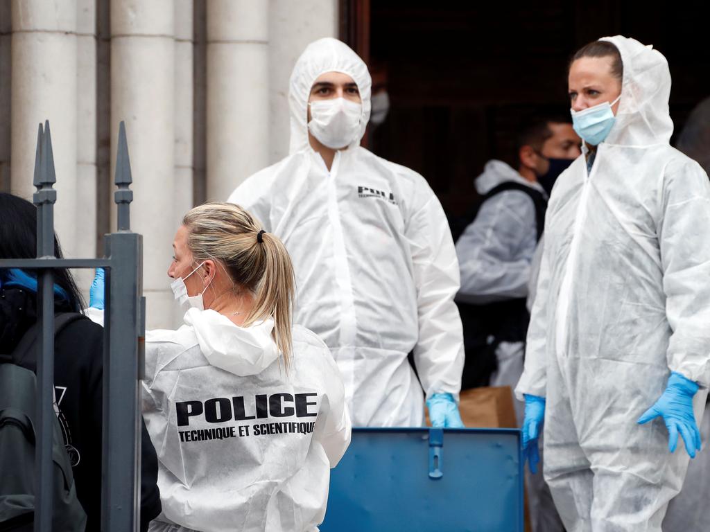French forensics officers operate outside the Basilica of Notre-Dame de Nice. Picture: Eric Gaillard/AFP