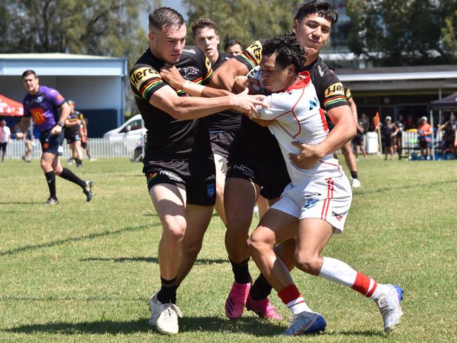 Ethan Hutchings (left) and Wilson De Courcey tackle Joven Gyemore in the SG Ball Cup. Picture: Sean Teuma/NewsLocal