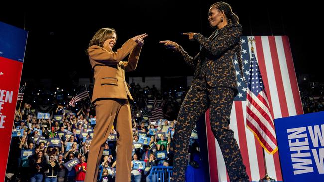 Kamala Harris greets former first lady Michelle Obama during a campaign rally in Kalamazoo, Michigan. Picture: Getty Images