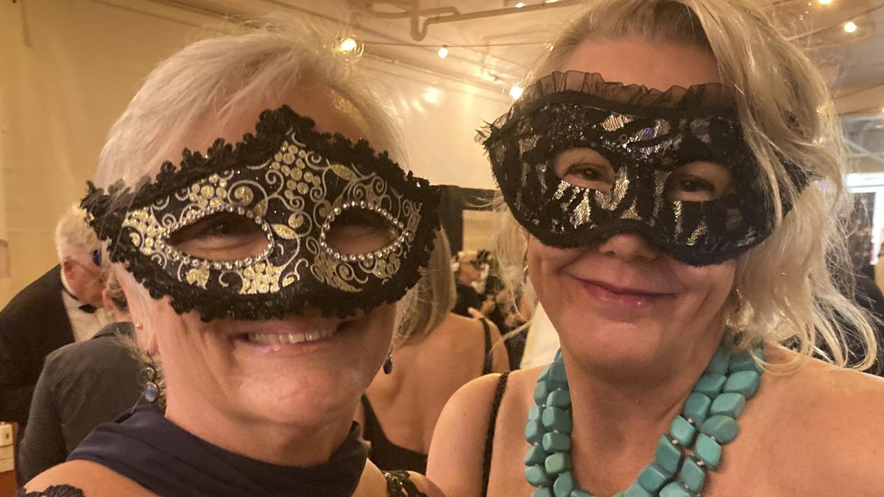 Michelle McArthur and Meaghan Kotzur celebrate at the Gympie RSL Masked Ball, April 29 2023.