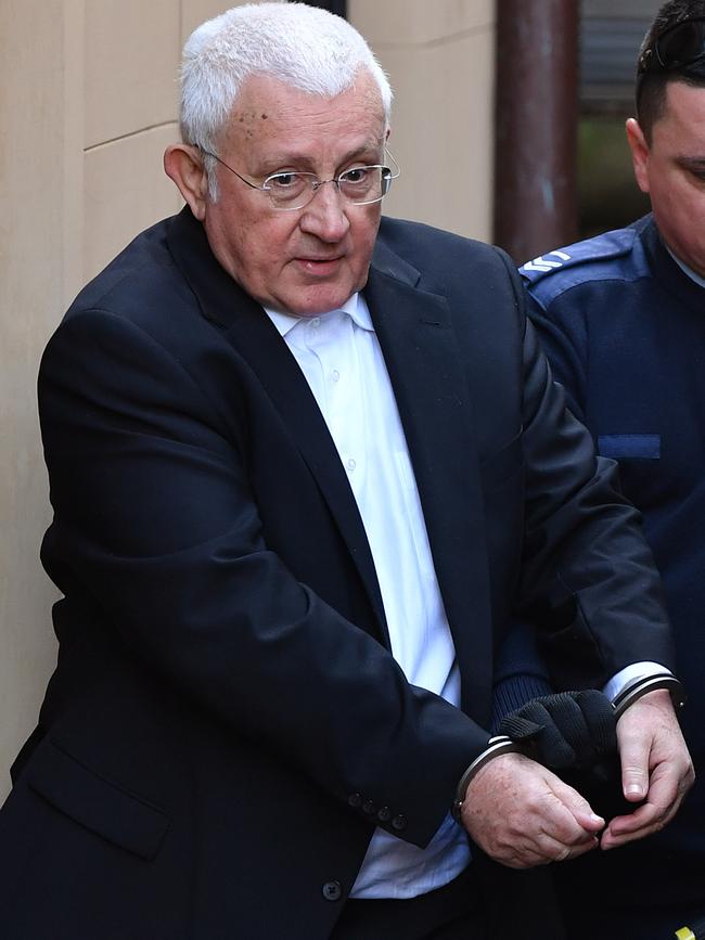 Ron Medich is escorted to a NSW Corrective Services van at the NSW Supreme court in Sydney in 2018. 