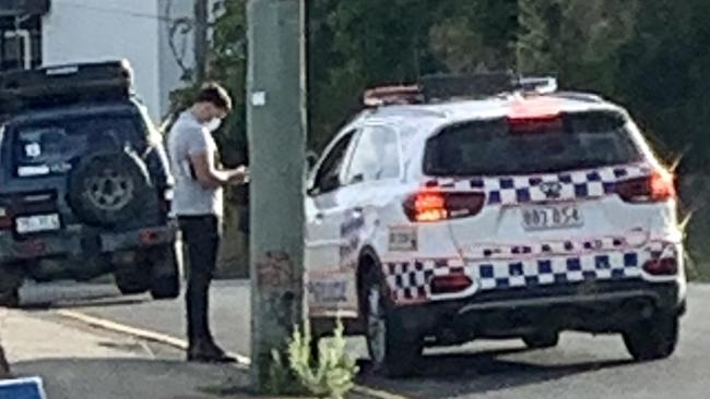 Police speak to a pedestrian in Dixon St, Coolangatta, near the Queensland border with NSW. Picture: Greg Stolz