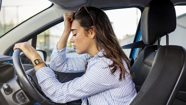 Stressed woman drive car feeling sad and angry. Girl tired, fatigue mental on car. Sleepy and drunk female hangover. Illegal law driver license. Driving when tired and do not drive drowsy concept