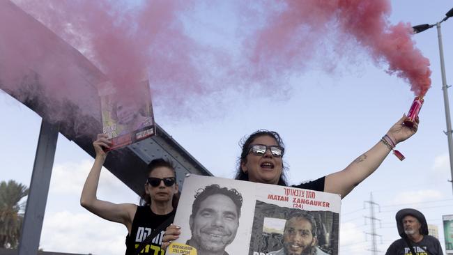 Families of hostages held in the Gaza Strip set off flares as they block a main road during a rally calling for an hostages deal in Tel Aviv, Israel. Picture: Amir Levy/Getty Images