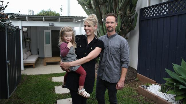 Jessie Schattner and Evan Blake with daughter Sierra, 3, at their home in Sydenham in Sydney’s inner west. Picture: Britta Campion