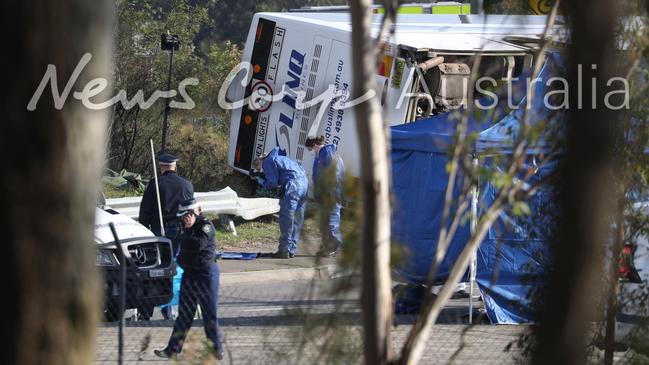 Investigators at the crash site on Monday. Picture: John Grainger